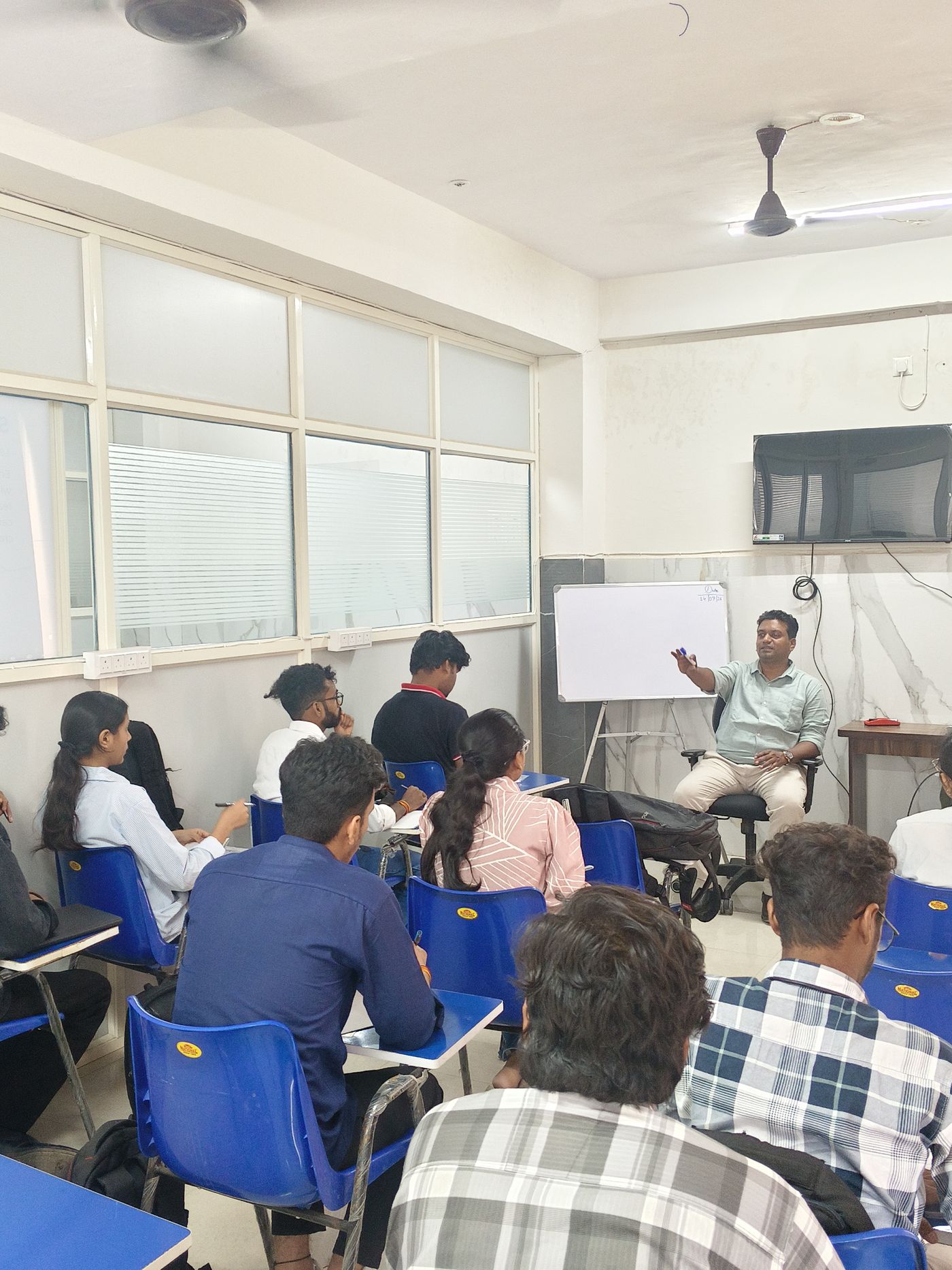 Trainer leading a workshop discussion